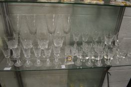 A small Waterford crystal clock and other glassware.