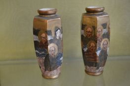 A pair of small Satsuma vases decorated with figures.