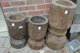 Three large turned wood mortars.