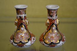 A pair of miniature Imari bottle vases.