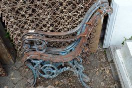 A pair of heavy cast iron bench ends.