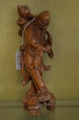 A Chinese carved wood figure of a sage.