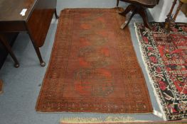 A small Bokhara type Persian rug with four central panels 200cms x 115cms.