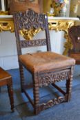 An 18th century carved walnut hall chair.