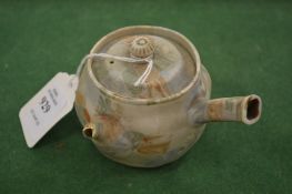 A small Japanese biscuit glazed porcelain ewer.