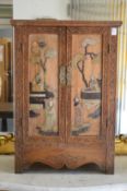 A Chinese small two-door cabinet with inlaid hardstone decoration.