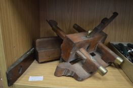 Three old woodworking tools.
