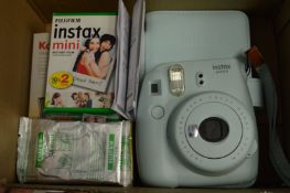 An Instax mini 9 camera etc.