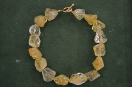 A chunky stone necklace.