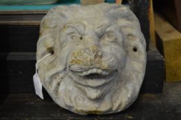 A cast lead lion's mask wall mounted fountain head.