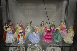 A collection of Royal Doulton figurines, many with original boxes.