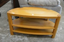 A modern light oak TV stand.