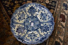 A Delft blue and white circular dish.