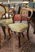 A pair of Victorian rosewood dining chairs.