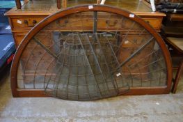 An oak framed and lead glazed four panel arch shaped fan light together with panels for another