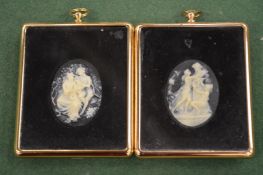 A pair of cameos, framed and glazed.