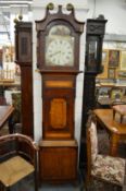 A 19th century mahogany and oak cased longcase clock with painted arched dial.