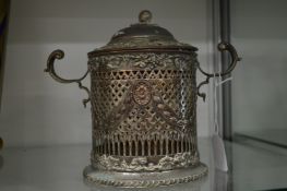 A plated biscuit jar.