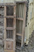Two pairs of old Indian hardwood doors with wrought iron slats.