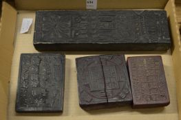 Four Chinese printing blocks.