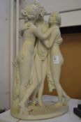 The Three Graces a small painted cast metal model.