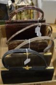 Four ladies' crocodile leather handbags.
