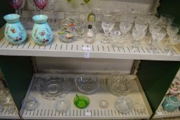 A quantity of glassware to include a pair of enamel decorated green opaque vases.
