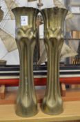 Trench art, a pair of brass shell cases fashioned as vases.