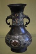 A Japanese cloisonne twin handled vase.