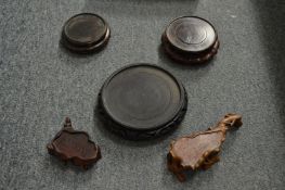 Five small Chinese wooden stands.