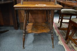 An oak two tier occasional table.