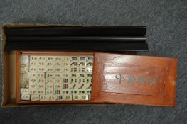 A boxed Mahjong set and stand.