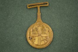 An unusual George III armorial badge or pass, engraved to the reverse Number 9, George Webster, 25th