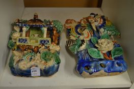 Two Chinese polychrome decorated pottery wall pockets.