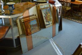A large Art Deco overmantle mirror engraved with musical and other motifs.