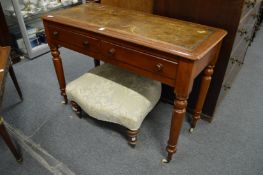 A Victorian mahogany two-drawer writing table.