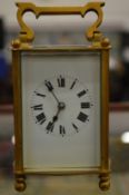 A brass carriage clock.