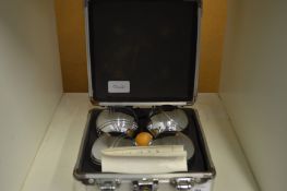 An aluminium cased set of boulles.