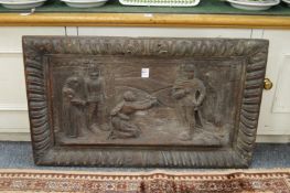 A carved wood panel.