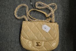 A ladies' cream handbag.