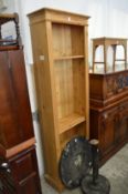 A pine narrow standing bookcase.