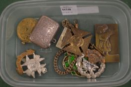A silver vesta case, a small bronze plaque and other items.
