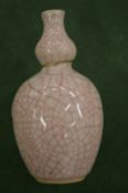 A small Chinese Kangxi period double gourd porcelain vase.