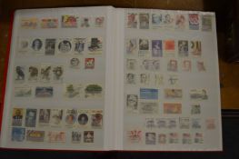 A stamp album containing Cuba and USA.