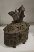 An eastern bronze censer with bird mount.