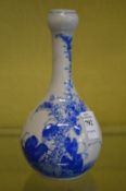 A blue and white bottle vase.