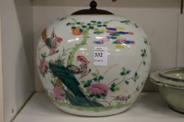 A Chinese Famille Rose globular shaped vase with hardwood cover.