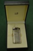A boxed Dunhill lighter.