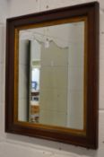 A mahogany framed mirror.