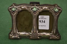 A miniature Art Nouveau style silver double photograph frame.